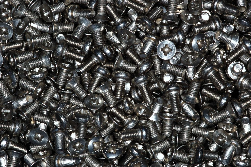 pile of fasteners including shear nuts